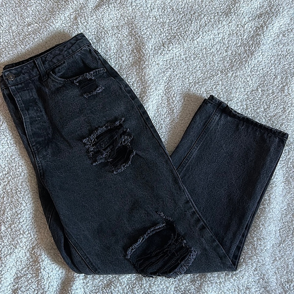 Black Straight Legged Jeans with Rips.